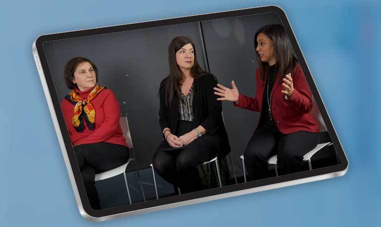 Tablet with a screenshot of a panel of women